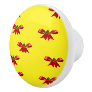 Christmas red ribbon on yellow ceramic knob