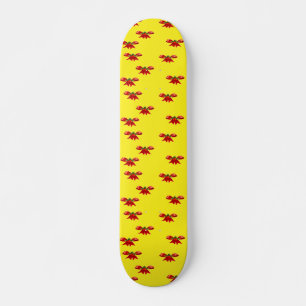 Christmas red ribbon on yellow skateboard