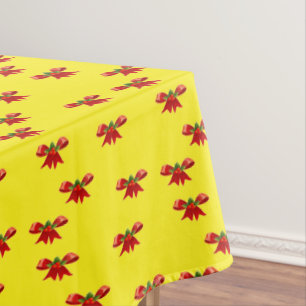 Christmas red ribbon on yellow tablecloth