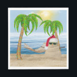 Christmas Sandman On Tropical Beach Napkin<br><div class="desc">Cute sandman wearing a Santa Claus hat and sunglasses on beach sand with holiday lights in palm trees and hammock.</div>