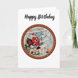 Christmas Santa flying a old aeroplane Holiday Card