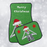 Christmas Skeleton Ornaments Santa Hat Stars Green Car Mat<br><div class="desc">This set of car mats are dark green covered in tiny gold specks with a smiling skeleton holding shiny ornaments up to his eyes wearing a red Santa Hat.  Rear mats have red stars.  Customise the Merry Christmas text on front mats with the templates.</div>