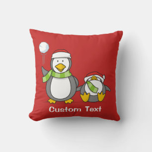 Christmas Snowballing penguins Cushion