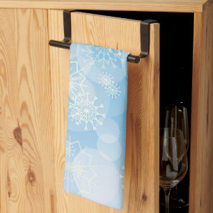 Christmas snowflakes on a blue background tea towel