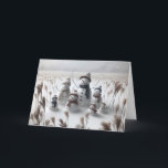 Christmas Snowman Family Holiday Card<br><div class="desc">Family of snowmen stand in a snowy field each wearing cosy hats and scarves surrounded with tall grass
All text can be changed.</div>