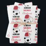 Christmas Soccer Ball Sports Football Custom Name Wrapping Paper Sheet<br><div class="desc">A cute illustration of soccer ball wearing a Santa hat with words "Merry Christmas" and your custom name. Perfect for adults and kids who love playing football. An ideal soccer themed Christmas wrapping paper for soccer players, soccer coaches, soccer teams, athletes and soccer enthusiasts. Simply customise the name and make...</div>