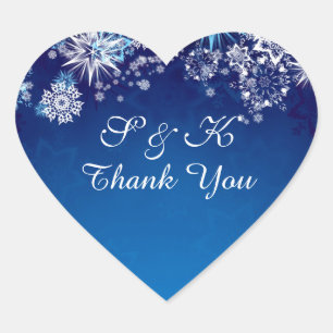 Christmas white snowflakes on blue heart shaped heart sticker