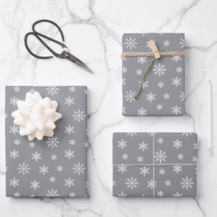 Christmas white snowflakes on grey background wrapping paper sheet