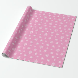 Christmas white snowflakes on pink background wrapping paper