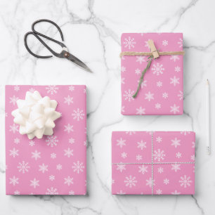 Christmas white snowflakes on pink background wrapping paper sheet