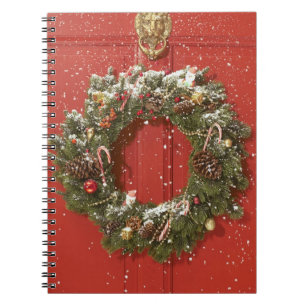 Christmas wreath hanging on a door notebook