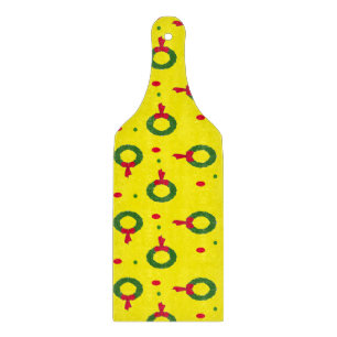 Christmas wreath on yellow cutting board