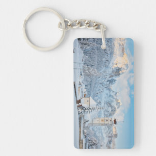 Church covered in snow with mountain background key ring