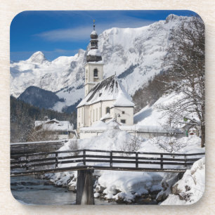 Church in the snow with Alps mountains Coaster