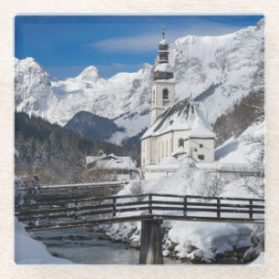 Church in the snow with Alps mountains Glass Coaster