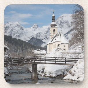 Church in the snow with Alps mountains in winter Coaster