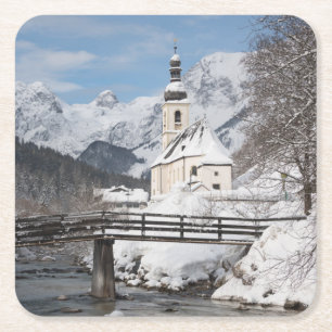 Church in the snow with Alps mountains in winter Square Paper Coaster