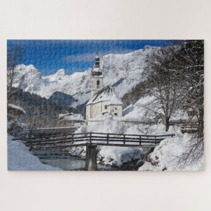 Church in the snow with Alps mountains Jigsaw Puzzle