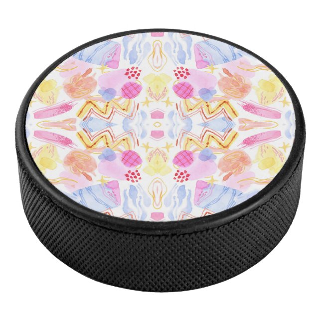 Circular object featuring a colourful abstract  hockey puck (3/4)