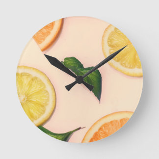 Citrus fruit pattern in pastel colours round clock