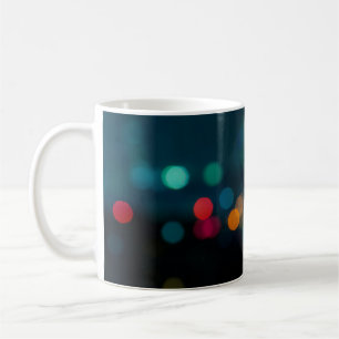 City night light blur bokeh, defocused backgrounda coffee mug