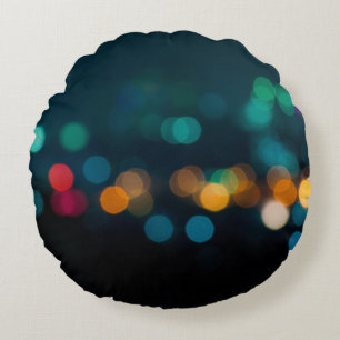 City night light blur bokeh, defocused backgrounda round cushion