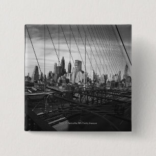 Cityscape through bridge cables 15 cm square badge