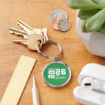 Class Of  Keychain<br><div class="desc">Grad class keychain is shown in a green and white color design.
Text: Class of 2026.



Licensed</div>