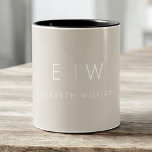 Classic Beige Taupe Neutral Minimalist Monogram Two-Tone Coffee Mug<br><div class="desc">Start your day with this classic beige taupe neutral minimalist monogram two-tone coffee mug. Featuring a soft beige taupe background, clean black typography, and a simple modern layout, this personalised mug blends understated elegance with everyday functionality. Perfect for weddings, anniversaries, corporate gifts, or anyone who loves chic neutral drinkware. Customise...</div>