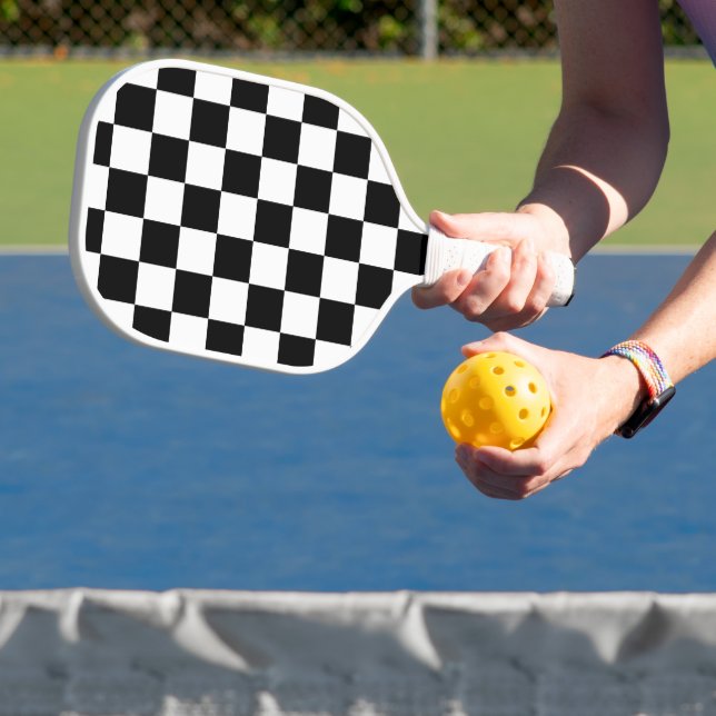 Classic black chequerboard pickleball paddle (Insitu)