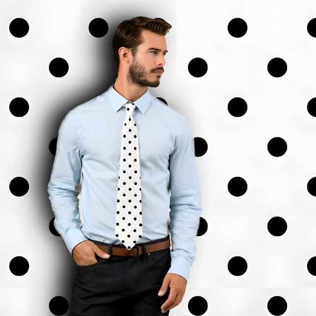 Classic Black Polka Dot Pattern on White Tie (Man wearing a white necktie with black poka dots. He stands against a B&W poka dotted wall.)
