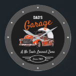 Classic Chevy Truck Garage Dad's Any Name Black Large Clock<br><div class="desc">Dad's or any name garage with 50's Chevy on a black background with orange script and a grey border. Just use the personalise this template option to change the text. Funny slogan typography with any date. Just choose the hand colour and size.</div>