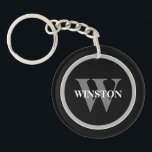 Classic Monogram: Personalised Black, White, and G Key Ring<br><div class="desc">Introducing our "Classic Monogram" Keychain – a perfect blend of elegance and functionality. This sophisticated accessory is designed for those who appreciate a classic style with a personal touch. Its elegant black, white, and grey colour scheme exudes a timeless sophistication that complements any set of keys. Personalise this keychain with...</div>