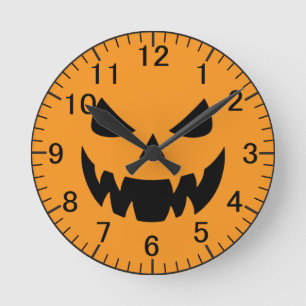 Classic, spooky pumpkin face round clock