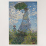 Claude Monet Painting of Lady with Parasol  Jigsaw Puzzle<br><div class="desc">Claude Monet's 'Lady with a Parasol' which is of Mrs. Monet and her son. Beautiful,  evocative painting of a perfect summer day. The blue sky and white clouds shimmer with the nuances of colour that Monet was able to create with his paints.</div>