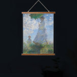 Claude Monet Wall Art Woman With A Parasol<br><div class="desc">Claude Monet,  Woman With A Parasol,  1800s. Old famous painting with a girl on a white dress holding a green umbrella on a garden or hill in an impressionist style. Printed on a wood-framed wall-hanging tapestry. CCO license,  public domain art.</div>