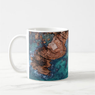 Clear blue sea and rocks coffee mug