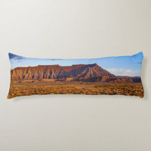clear blue sky covers gorgeous brown hill body cushion