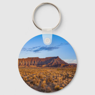 clear blue sky covers gorgeous brown hill key ring