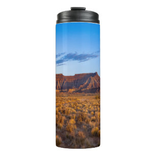 clear blue sky covers gorgeous brown hill thermal tumbler