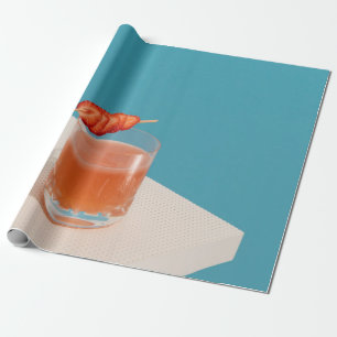 Clear drinking glass with brown liquid wrapping paper
