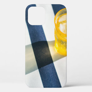 Clear drinking glass with yellow liquid iPhone 12 case