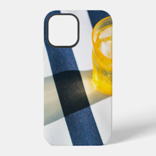 Clear drinking glass with yellow liquid iPhone 12 case