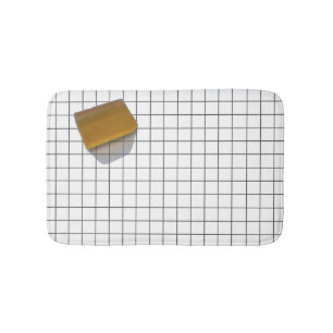Clear Soap on a Tile Floor Bath Mat