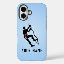 Climber scaling challenging rockface, own name on