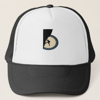Climbing mountain man at night silhouette trucker hat