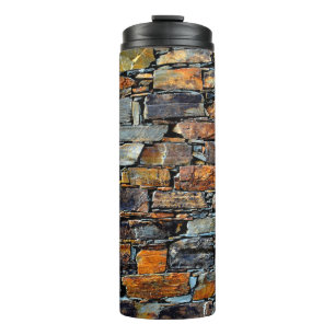 Close-up detail view of an old traditional stone w thermal tumbler