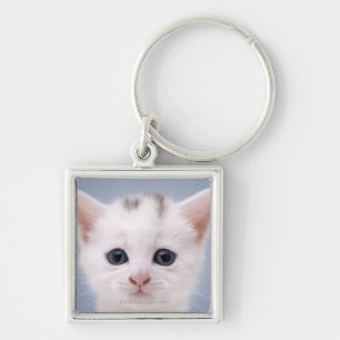 Close up image of a predominately white faced key ring