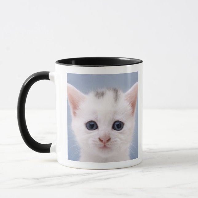 Close up image of a predominately white faced mug (Left)