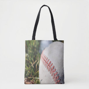 Close Up of a Baseball in Grass Tote Bag